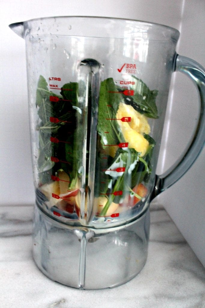 blender with spinach fruit smoothie